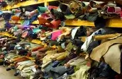 Проход между стеллажами с кожей на оптовом складе METAFORA